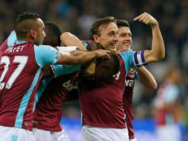 West Ham's Edimilson Fernandes (C) celebrates with teammates after scoring against Chelsea. AFP
