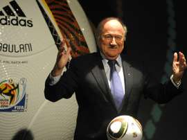FIFA President Sepp Blatter posing with Jabulani the official Adidas match ball for the 2010 World Cup during the handover event in 2009