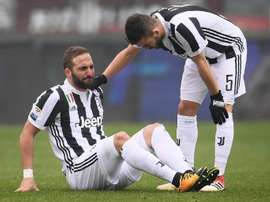 Higuain, Bernardeschi blow for Juventus in bruising derby win. AFP