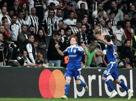 Dynamos Viktor Tsygankov (L) celebrates with teammate Mykola Mozozyuk after scoring a goal. AFP