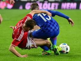 Croatias Domagoj Antoli (R) vies with Hungarys Mihaly Korhut (L). BeSoccer