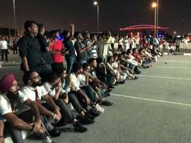 Indian fans who could not get tickets watch on a giant screen outside. AFP