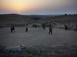 Israeli Bedouin children play football in the village of Abu Tlool. AFP