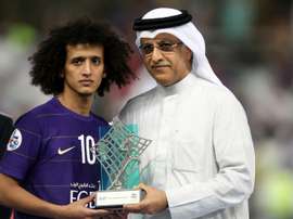 President of the Asian Football Confederation Shaikh Salman bin Ebrahim Al Khalifa (R) presents Al-Ains midfielder Omar Abdulrahman with the man of the match trophy on November 26, 2016
