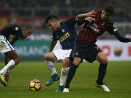 Gary Alexis Medel (C) in action during an Italian league match against AC Milan. AFP