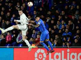 Bale (L) is making it difficult for Real Madrid to sell him this summer. AFP