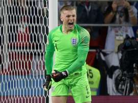 Le possible départ de Courtois pourrait s'accompagner avec celui de Pickford d'Everton. AFP