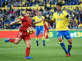 Sevillas forward Wissam Ben Yedder (L) clashes with Las Palmas defender Aythami Artiles