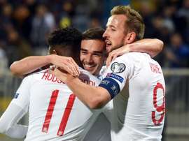 Harry Winks (C) could move to Manchester City. AFP