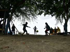 Children play football close to Caira beach in the commune of Leogane, south-west of Port-au-Prince