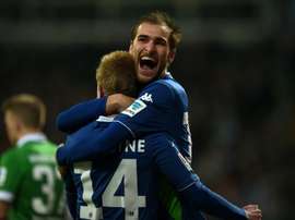 Wolfsburgs Bas Dost (R) and Kevin De Bruyne celebrate during a Bundesliga match on March 1, 2015