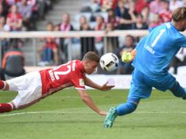 Bayern Munichs midfielder Joshua Kimmich (L) heads the first goal for Munich against Colognes goalkeeper Timo Horn (R) during the German first division Bundesliga football match between FC Bayern Munich and 1 FC Cologne
