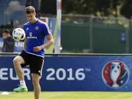 Northern Irelands defender Patrick McNair plays with the ball during a training session at their training ground in Saint-Georges-de-Reneins on June 6, 2016