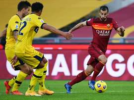 Roma want to keep in form Henrikh Mkhitaryan (R). AFP
