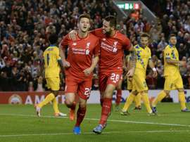 Liverpools midfielder Adam Lallana (L) celebrates with striker Danny Ings after scoring the opening goal of a UEFA Europa League group B football match against FC Sion at Anfield in Liverpool, north west England on October 1, 2015