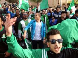 Libyans supporters arrive to attend the friendly football on December 15, 2015 at the International Stadium in the capital Tripoli