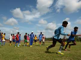 Under-privileged Indian schoolboys practice their football skills at The Durbar Sports Academy in Ramnagar