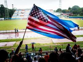 Fans wave Cuban and US flags on June 2, 2015, during the friendly game in Havana between the New York Cosmos and Cuba