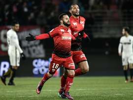 Dijons French midfielder Frederic Sammaritano (L) celebrates after scoring a goal during the French L1 football match Dijon vs Monaco on November 29, 2016