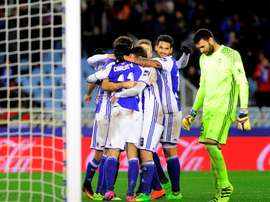 Real Sociedad players celebrate their team's win. Goal