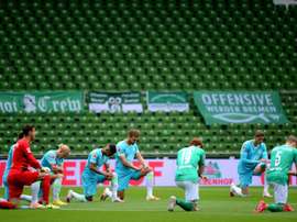 Werder slip towards drop as teams take knee for Floyd protests. AFP