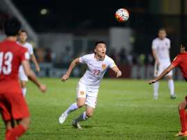 Chinas Yu Dabao (C) during the 2018 FIFA world cup qualifier against Hong Kong at Mong Kok stadium in Hong Kong on November 17, 2015