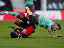Everton defender Lucas Digne (right) fouls Southamptons Kyle Walker-Peters. AFP