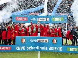 Feyenoord Rotterdams players celebrate with the trophy on the podium after winning the Dutch cup final football match against FC Utrecht, on April 24, 2016