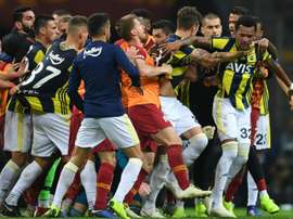 Fenerbahce and Galatasaray players fought at end of derby. AFP