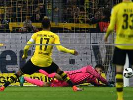 Dortmunds Pierre-Emerick Aubameyang shoots a penalty against Herthas Norwegian goalkeeper Rune Jarstein during a Bundesliga football match in Dortmund, western Germany on October 14, 2016
