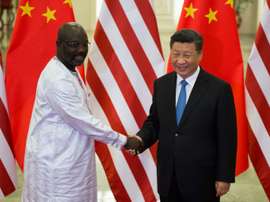 Weah pictured with China's General Secretary of the Communist Party, Xi Jinping. AFP