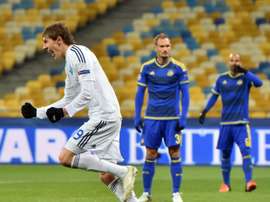 Dynamos midfielder Denys Garmash (L) celebrates after scoring during a UEFA Champions League match against Maccabi Tel-Aviv on December 9, 2015