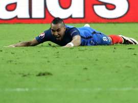 Frances forward Dimitri Payet celebrates after scoring Frances second goal during the Euro 2016 group A football match between France and Romania at Stade de France, in Saint-Denis, north of Paris, on June 10, 2016