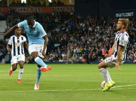 Manchester Citys Yaya Toure (L) scores from a deflection during their English Premier League match against West Bromwich Albion, at The Hawthorns in West Bromwich, central England, on August 10, 2015