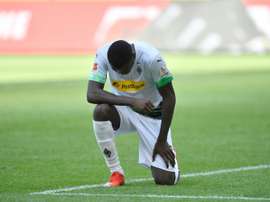 Thuram makes protest by taking a knee in Bundesliga. AFP