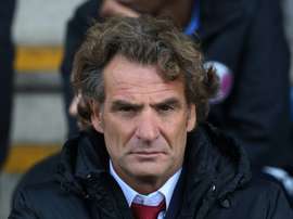 Qatars manager Jose Daniel Carreno looks on during the international friendly football match between Qatar and Northern Ireland at the Alexandra Stadium in Crewe on May 31, 2015