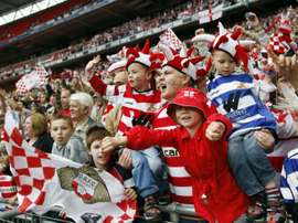 Doncaster Rovers supporters celebrate on May 25, 2008