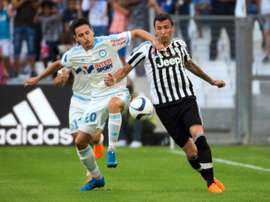 Marseilles Florian Thauvin (L) fights for the ball with Juventus Mario Mandzukic during the Robert Louis-Dreyfus Trophy friendly match, at the Velodrome stadium in Marseille, on August 1, 2015
