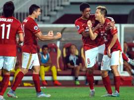 Guangzhou Evergrandes Huang Bowen (R) celebrates with teammates after scoring against Japans Kashiwa Reysol during their AFC Champions League quarterfinal match at the Tianhe Sport Center in Guangzhou on September 15, 2015