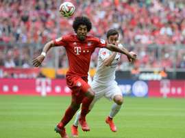 Bayern Munichs Brazilian defender Dante (left) and Mainzs midfielder Yunus Malli vie for the ball during their Bundesliga match at the Allianz Arena in Munich, southern Germany on May 23, 2015