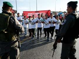 Palestinian youths wanting to play football in the Maale Adumim settlement in the Israeli occupied West Bank are blocked by Israeli security forces on October 11, 2016