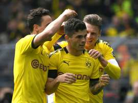 Dortmund took the title race to the wire after beating Duesseldorf. AFP