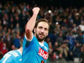 Napolis forward Gonzalo Higuain celebrates after scoring during an Italian Serie A football match against Inter Milan on November 30, 2015 at the San Paolo stadium in Naples