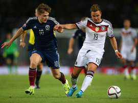 Germanys midfielder Mario Goetze (R) vies with Scotlands striker James Forrest during the Euro 2016 qualifying group D football match in Glasgow on September 7, 2015