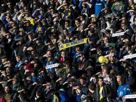 AFC Wimbledon fans cheer for their team at Stadium MK in Milton Keynes, central England, on December 2, 2012