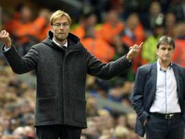 Liverpools manager Jurgen Klopp (L) gestures next to Rubin Kazans counterpart Valeri Chaly during their UEFA Europa League Group B match, at Anfield in Liverpool, on October 22, 2015