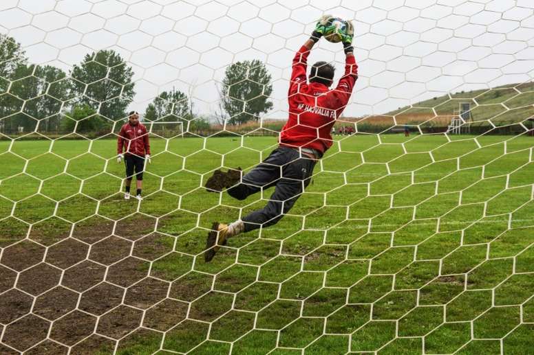Football players of FC Hajvalia during a training session near Kishnica, in the district of Pristina on May 12, 2016