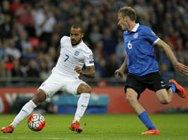 Englands striker Theo Walcott (L) vies for the ball against Estonias Aleksandr Dmitrijev during the Euro 2016 qualifying group E football match between England and Estonia at Wembley Stadium in north London on October 9, 2015