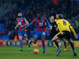 Crystal Palaces Togolese striker Emmanuel Adebayor (C) plays the ball during an English Premier League match at Selhurst Park in south London on February 13, 2016