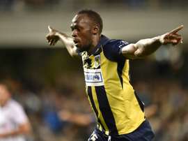 Bolt celebrating scoring a goal for Central Coast Mariners. AFP